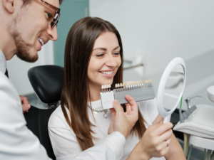 a person admiring their new veneers